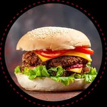 Groove Burger with halal beef, mushroom-lentil patty, tomato, onion, and buffalo aioli